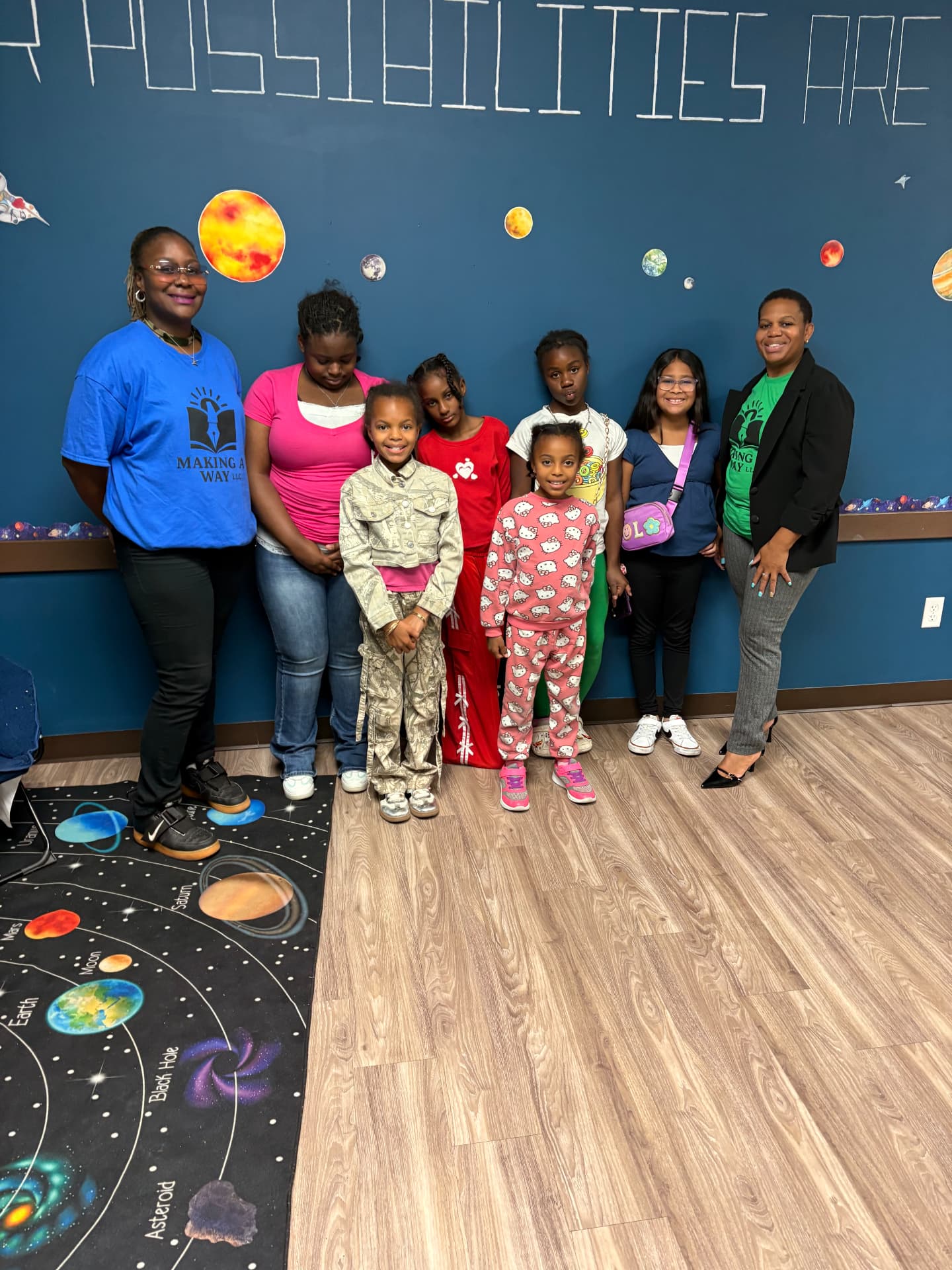 Young girls and mentors smiling together at a Making A Way event